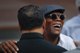 Actor Samuel Jackson, right, greets Rev. Jesse Jackson Sr. as they take their seats for the dedication ceremony of the Smithsonian Museum of African American History and Culture on the National Mall in Washington, Saturday, Sept. 24, 2016. (AP Photo/Pablo Martinez Monsivais)