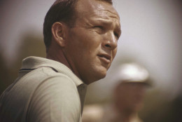 File-This jan. 28, 1962, file photo shows Arnold Palmer concentrating on his next move during the Lucky International Open at San Francisco's Harding Park. Palmer, who made golf popular for the masses with his hard-charging style, incomparable charisma and a personal touch that made him known throughout the golf world as "The King," died Sunday, Sept. 25, 2016, in Pittsburgh. He was 87. (AP Photo, File)