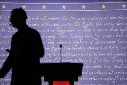 A producer walks past a podium on the stage for the presidential debate between Democratic presidential candidate Hillary Clinton and Republican presidential candidate Donald Trump at Hofstra University in Hempstead, N.Y., Monday, Sept. 26, 2016. (AP Photo/David Goldman)