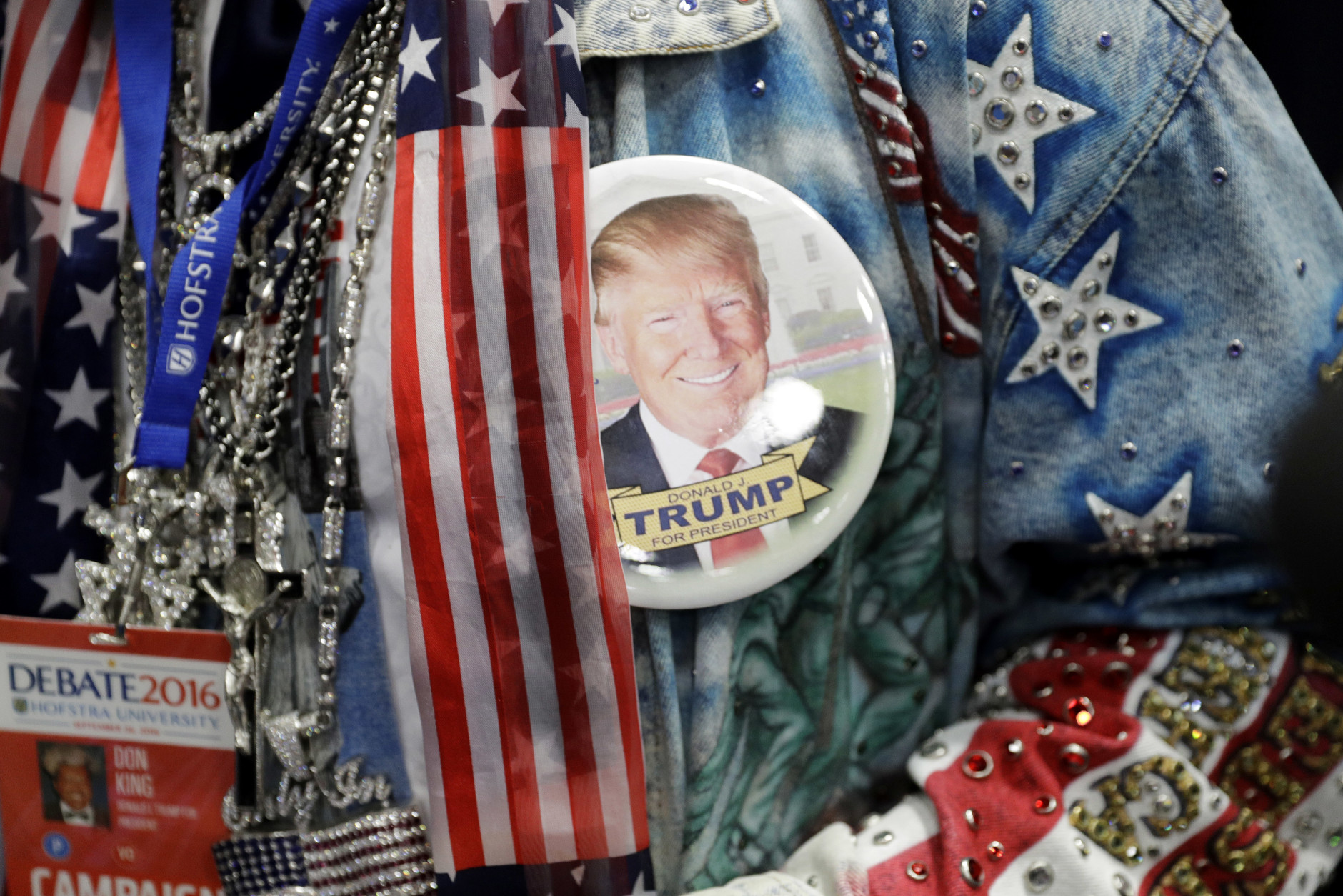 Boxing promoter Don King wears a button in support of Donald Trump before the presidential debate between Democratic presidential candidate Hillary Clinton and Republican presidential candidate Donald Trump at Hofstra University in Hempstead, N.Y., Monday, Sept. 26, 2016. (AP Photo/John Locher)