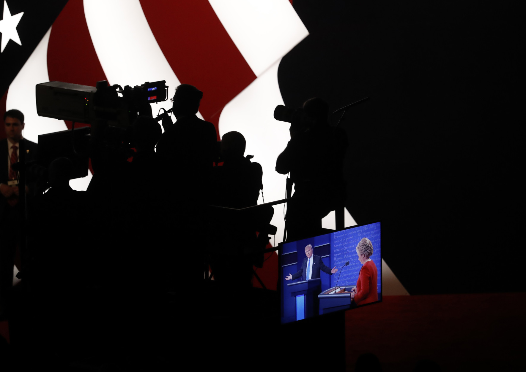 Democratic presidential nominee Hillary Clinton and Republican presidential nominee Donald Trump appear on a monitor during the presidential debate at Hofstra University in Hempstead, N.Y., Monday, Sept. 26, 2016. (AP Photo/Mary Altaffer)