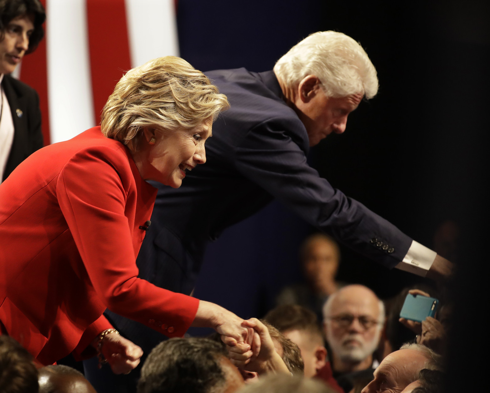 Democratic presidential nominee Hillary Clinton shakes hands with her husband Bill Clinton and audience members after the presidential debate with Republican presidential nominee Donald Trump at Hofstra University in Hempstead, N.Y., Monday, Sept. 26, 2016. (AP Photo/Julio Cortez)