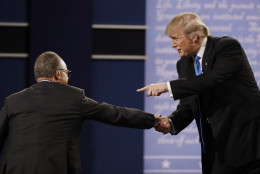 Republican presidential nominee Donald Trump shakes hands Moderator Lester Holt, anchor of NBC Nightly News, following the presidential debate with Democratic presidential nominee Hillary Clinton at Hofstra University in Hempstead, N.Y., Monday, Sept. 26, 2016. (AP Photo/Patrick Semansky)