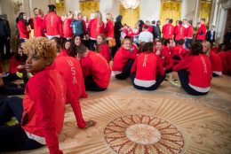 Members of the 2016 United States Summer Olympic and Paralympic Teams sit on the carpet in the East Room of the White House in Washington, Thursday, Sept. 29, 2016, before the start of a ceremony where President Barack Obama honored them. (AP Photo/Andrew Harnik)