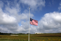 A flag flies at half staff at the Flight 93 National Memorial in Shanksville, Pa, Friday, Sept. 11, 2015, as the nation marks the 14th anniversary of the Sept. 11 attacks. At lower left is the Wall of Names,and upper right is the Flight 93 National Memorial Visitors Center. (AP Photo/Gene J. Puskar)