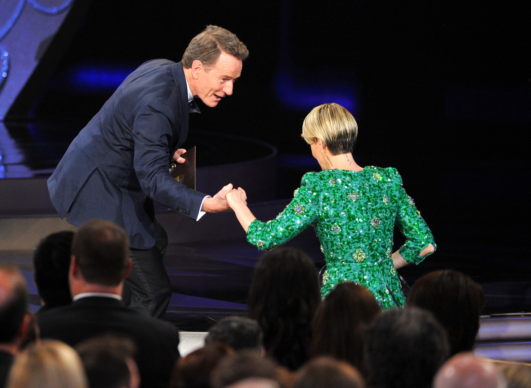 Bryan Cranston, left, presents the award to Sarah Paulson for outstanding lead actress in a limited series or a movie for The People v. O.J. Simpson: American Crime Story at the 68th Primetime Emmy Awards on Sunday, Sept. 18, 2016, at the Microsoft Theater in Los Angeles. (Photo by Vince Bucci/Invision for the Television Academy/AP Images)