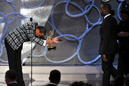 Terrence Howard, left, presents the award for outstanding supporting actor in a limited series or a movie to Sterling K. Brown for The People v. O.J. Simpson: American Crime Story at the 68th Primetime Emmy Awards on Sunday, Sept. 18, 2016, at the Microsoft Theater in Los Angeles. (Photo by Vince Bucci/Invision for the Television Academy/AP Images)