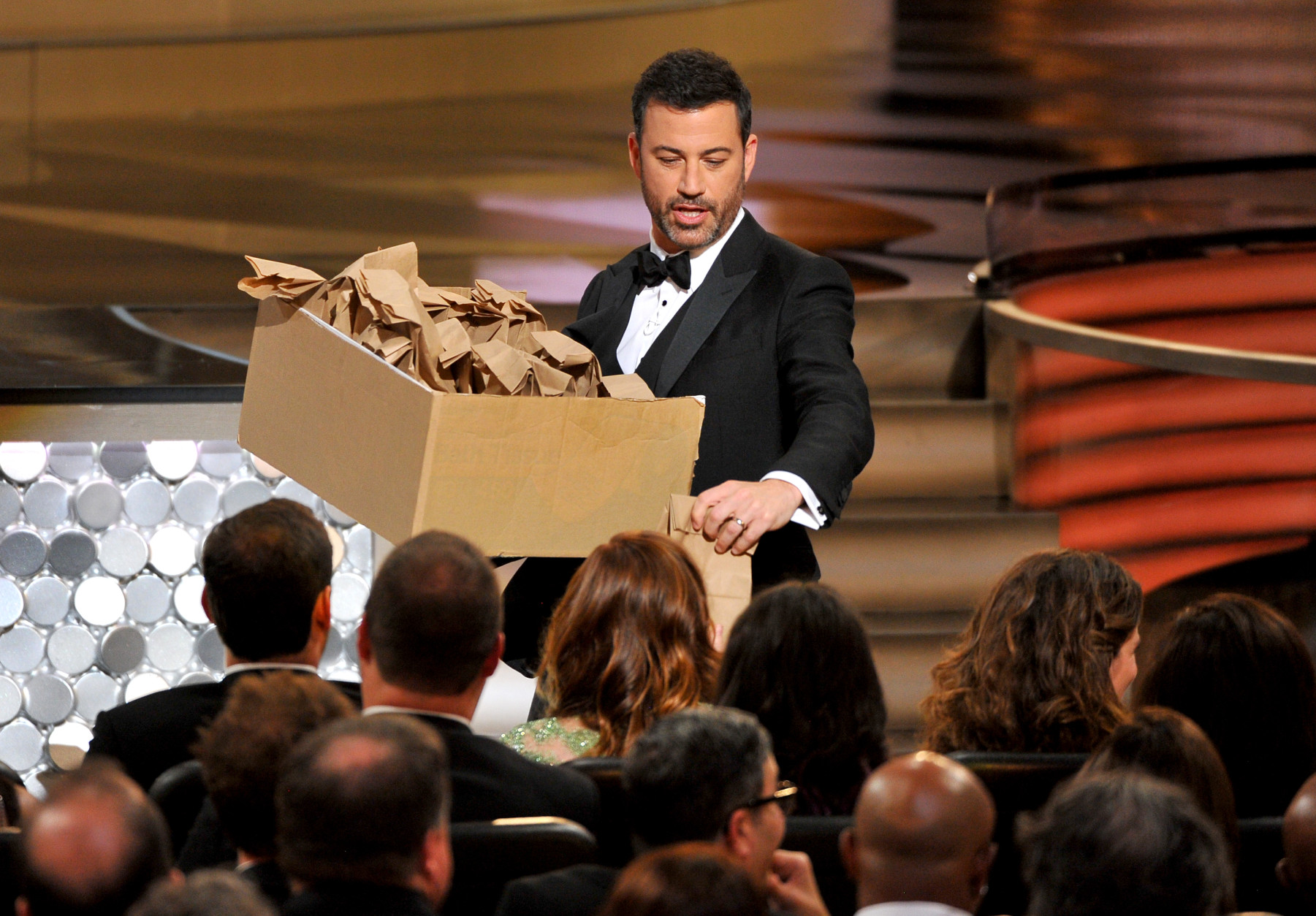 Host Jimmy Kimmel hands out peanut butter and jelly sandwiches at the 68th Primetime Emmy Awards on Sunday, Sept. 18, 2016, at the Microsoft Theater in Los Angeles. (Photo by Vince Bucci/Invision for the Television Academy/AP Images)