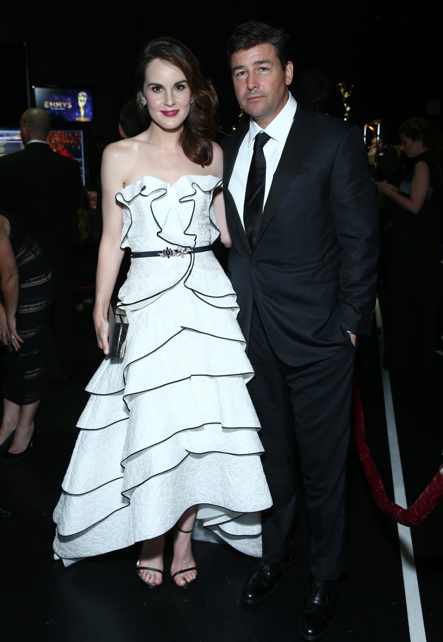 Michelle Dockery, left, and Kyle Chandler pose backstage at the 68th Primetime Emmy Awards on Sunday, Sept. 18, 2016, at the Microsoft Theater in Los Angeles. (Photo by John Salangsang/Invision/AP)
