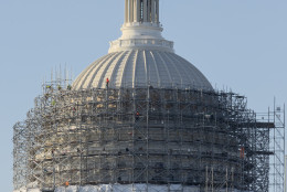 Workmen take apart the scaffolding that has shrouded the Capitol Dome for two years as it received a multi-million dollar renovation to repair cracks, remove lead paint and restore the structure to its original splendor, Monday, March 21, 2016, on Capitol Hill in Washington. (AP Photo/J. Scott Applewhite)