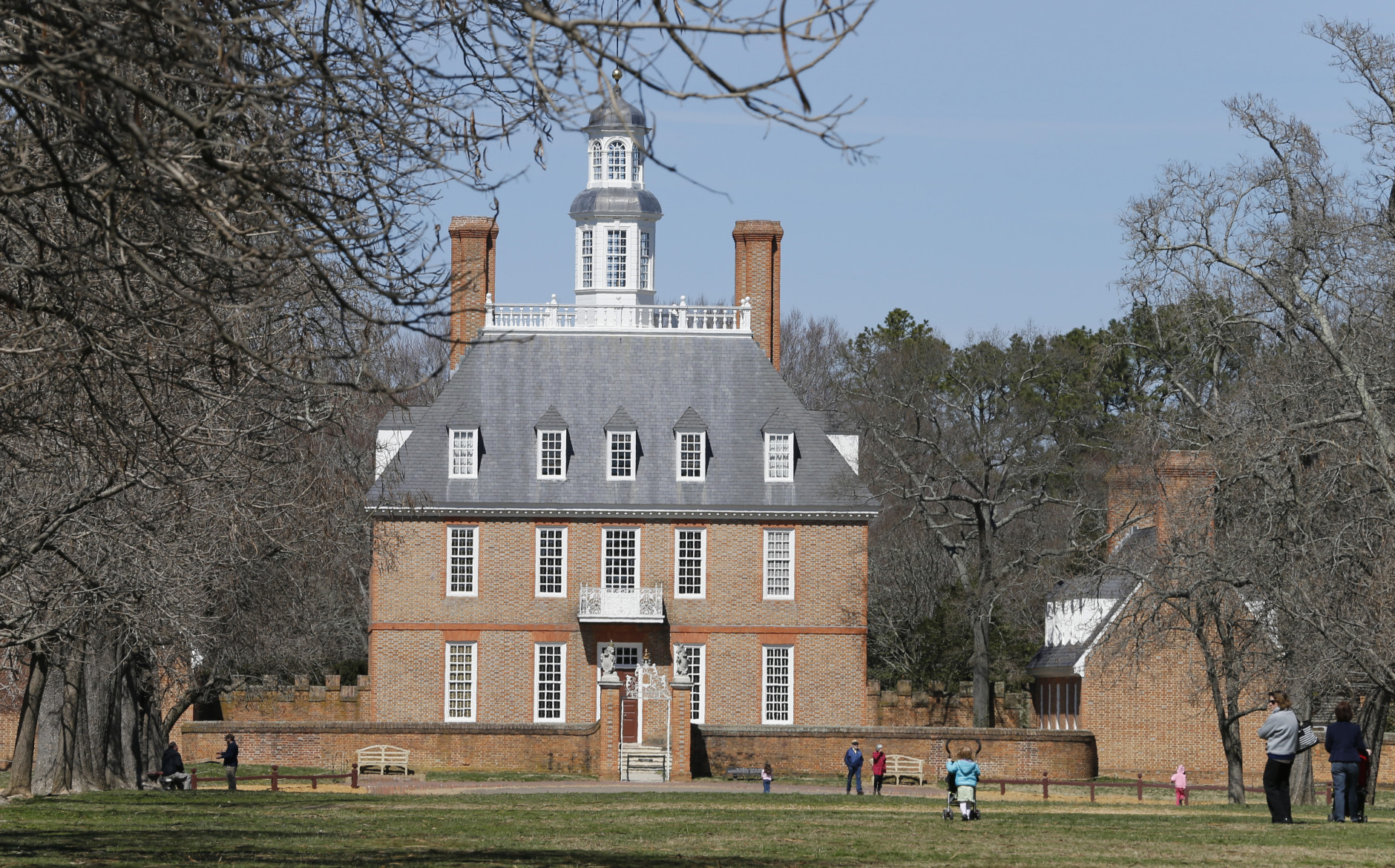 Visitors walk to the Governors palace along Duke of Gloucester street in the Colonial Williamsburg area of Williamsburg, Va., Wednesday, March 18, 2015. AP Photo/ Steve Helber)