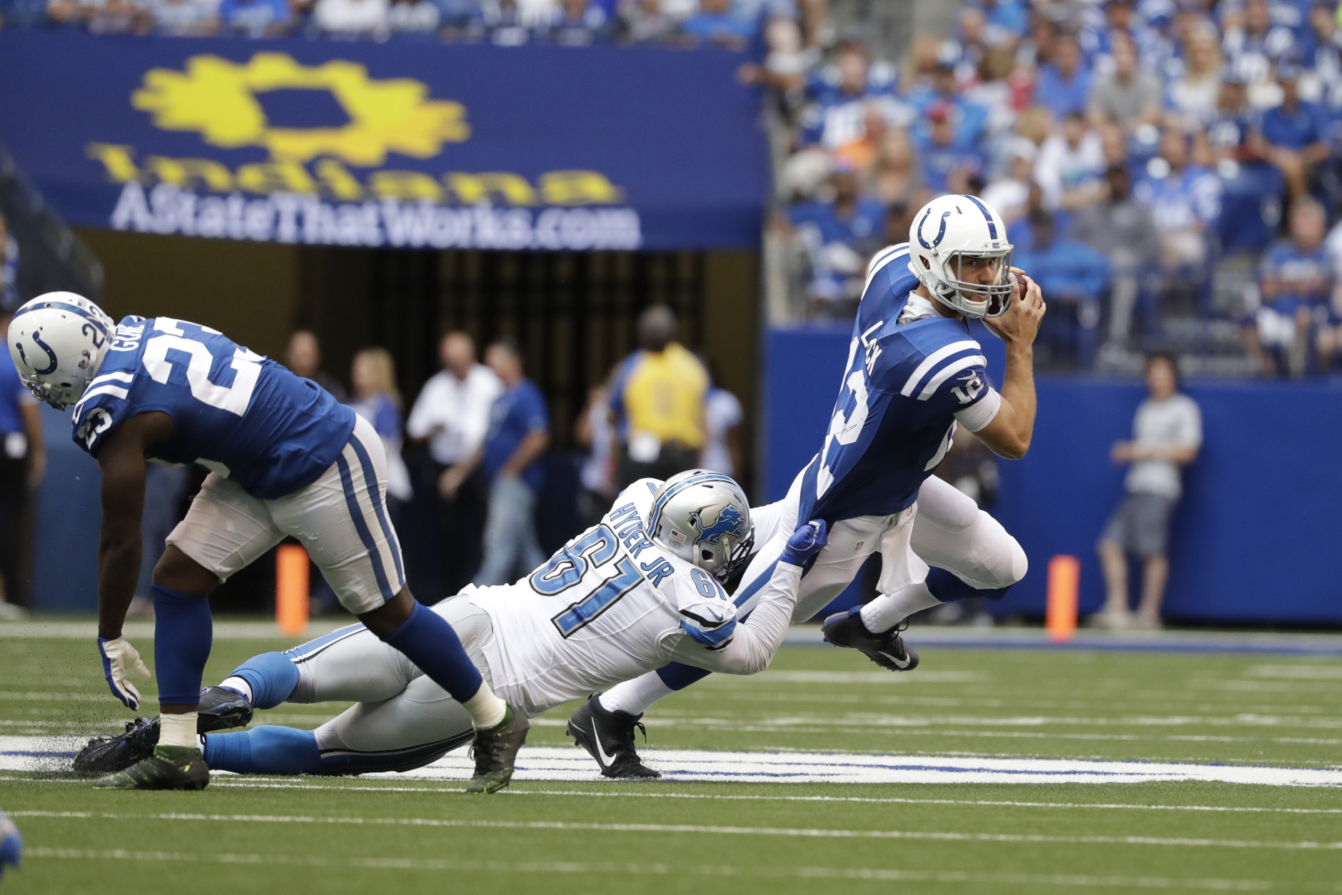 Detroit Lions defensive end Kerry Hyder (61) sacks Indianapolis Colts quarterback Andrew Luck (12) during the first half of an NFL football game in Indianapolis, Sunday, Sept. 11, 2016. (AP Photo/Jeff Roberson)