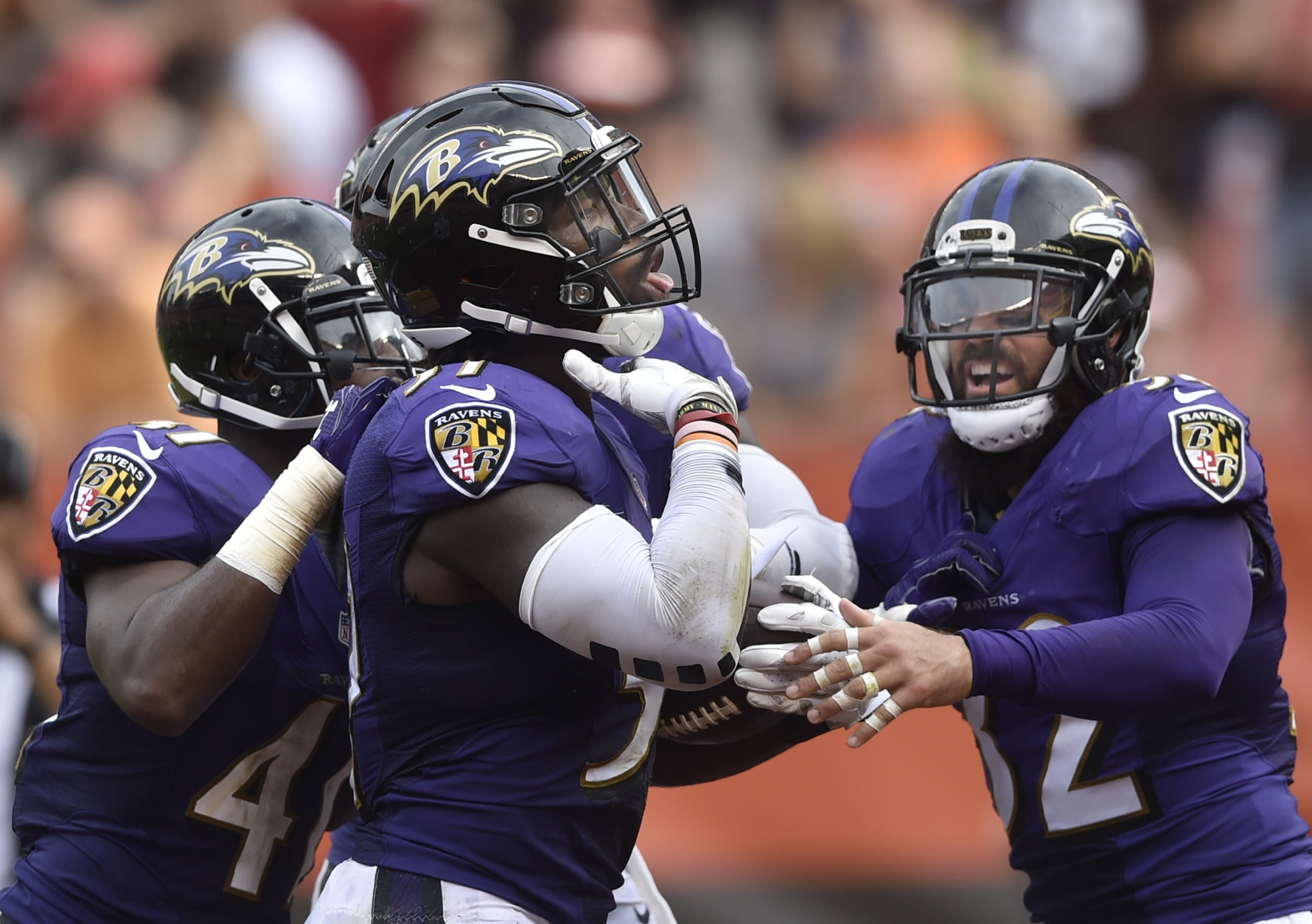 Baltimore Ravens inside linebacker C.J. Mosley (57) celebrates with strong safety Eric Weddle (32) after intercepting a pass in the fourth quarter of an NFL football game against the Cleveland Browns, Sunday, Sept. 18, 2016, in Cleveland. Baltimore won 25-20. (AP Photo/David Richard)