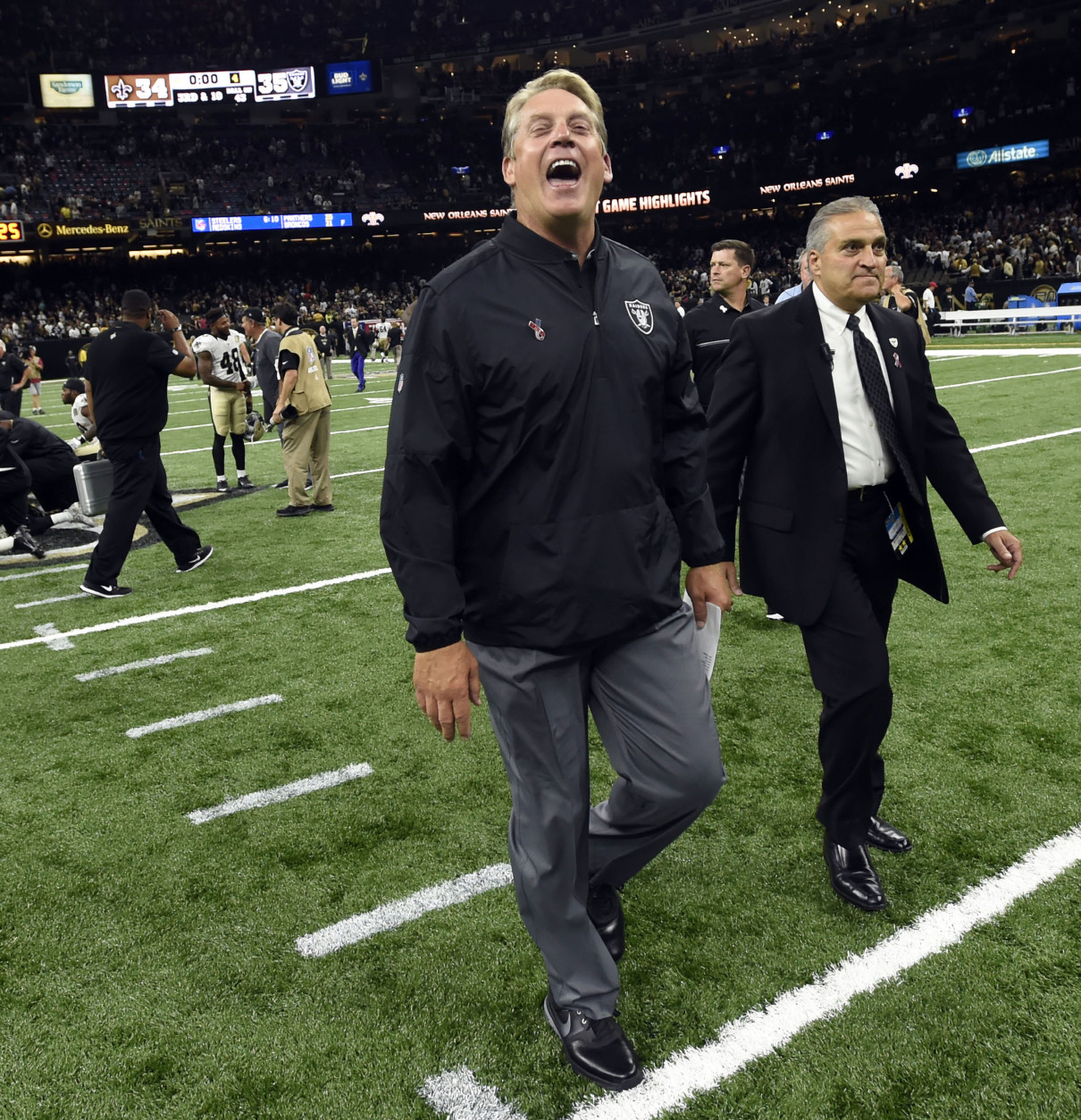 Oakland Raiders head coach Jack Del Rio lets out a yell as he walks off the field after  an NFL football game against the Oakland Raiders in New Orleans, Sunday, Sept. 11, 2016. The Raiders won 35-34. (AP Photo/Bill Feig)