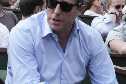 British actor Hugh Grant watches Andy Murray in his second round match of the French Open tennis tournament against Frances Mathias Bourgue at the Roland Garros stadium in Paris, France, Wednesday, May 25, 2016. (AP Photo/Alastair Grant)