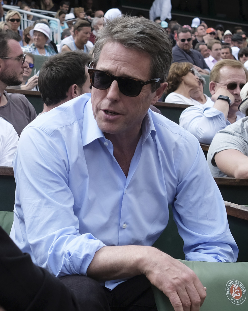 British actor Hugh Grant watches Andy Murray in his second round match of the French Open tennis tournament against Frances Mathias Bourgue at the Roland Garros stadium in Paris, France, Wednesday, May 25, 2016. (AP Photo/Alastair Grant)