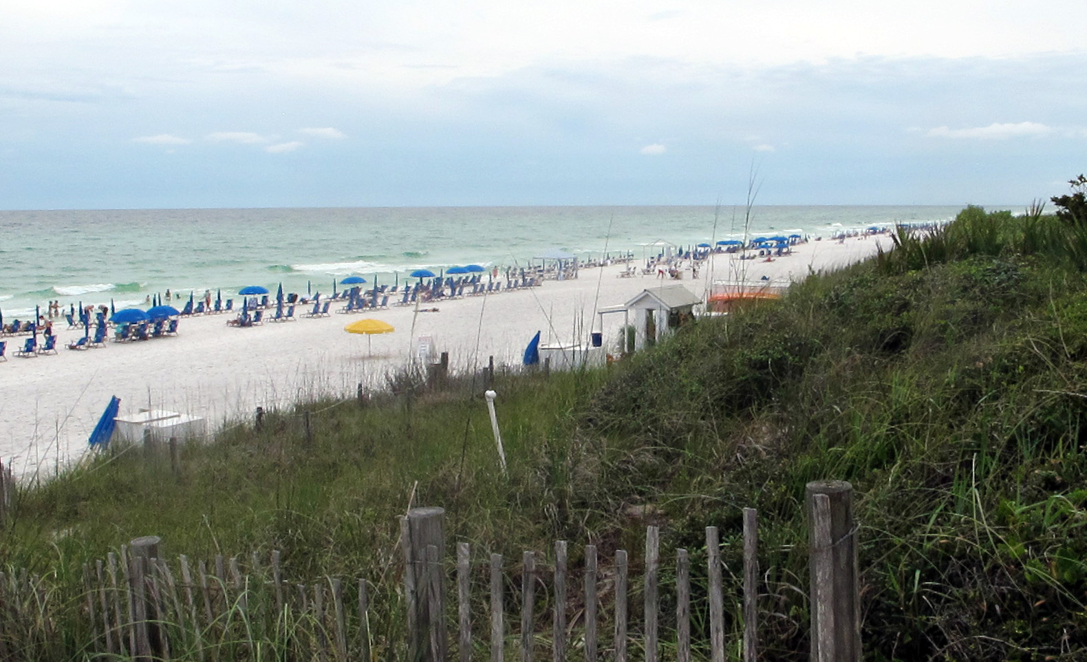 In this June 9, 2015 photo, umbrella chairs dot the beach along County Road 30A in the Florida Panhandle, in Walton County, Fla. "Nashville South," a once quiet, isolated about 26-mile stretch of the Panhandle between Destin and Panama City that has transformed into a vacation capital for the South's rich and famous. (AP Melissa Nelson-Gabriel)