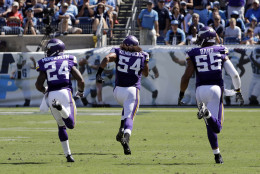 Minnesota Vikings linebacker Eric Kendricks (54) returns an intercepted pass 77 yards for a touchdown against the Tennessee Titans in the second half of an NFL football game Sunday, Sept. 11, 2016, in Nashville, Tenn. With Kendricks are Captain Munnerlyn (24) and Anthony Barr (55). (AP Photo/James Kenney)