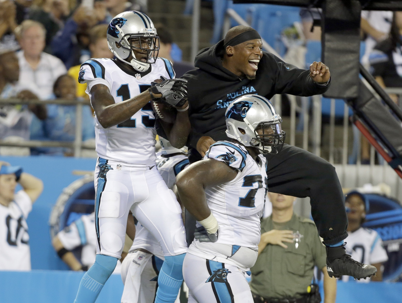 Carolina Panthers' Cam Newton, right, celebrates with Keyarris Garrett (15) after a play against the Pittsburgh Steelers in the first half of a preseason NFL football game in Charlotte, N.C., Thursday, Sept. 1, 2016. (AP Photo/Bob Leverone)
