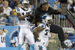 Carolina Panthers' Cam Newton, right, celebrates with Keyarris Garrett (15) after a play against the Pittsburgh Steelers in the first half of a preseason NFL football game in Charlotte, N.C., Thursday, Sept. 1, 2016. (AP Photo/Bob Leverone)