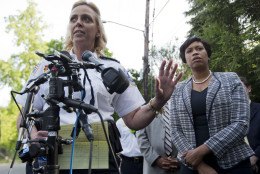 District of Columbia Police Chief Cathy Lanier, left, with Mayor Muriel Bowser, talks to reporters about a fire at a home in Northwest Washington, Thursday, May 14, 2015, where four people were found dead after firefighters entered a home in an upscale Washington neighborhood.  (AP Photo/Manuel Balce Ceneta)