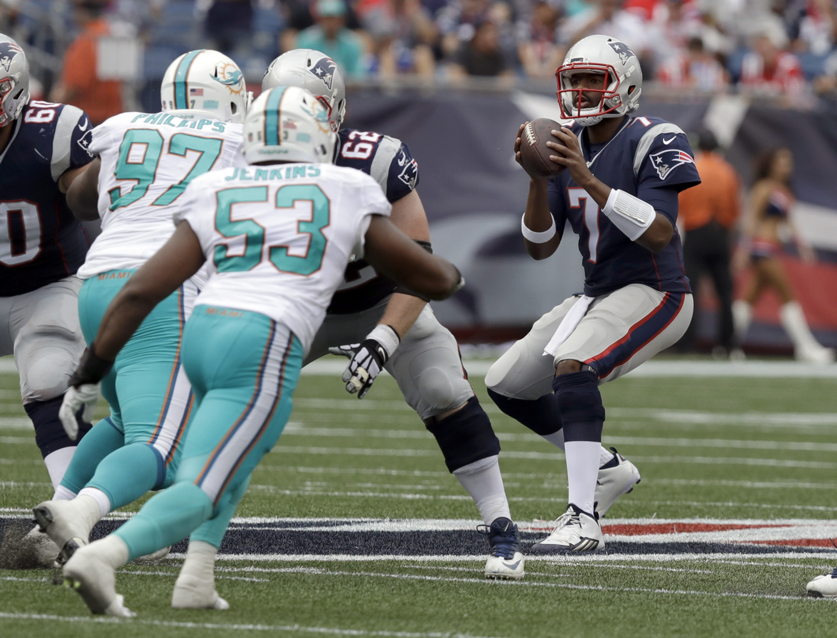 New England Patriots quarterback Jacoby Brissett (7) drops back to pass as Miami Dolphins defensive tackle Jordan Phillips (97) and linebacker Jelani Jenkins (53) rush during the first half of an NFL football game Sunday, Sept. 18, 2016, in Foxborough, Mass. (AP Photo/Charles Krupa)