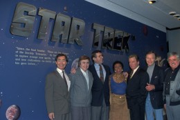 Cast members of the origninal Star Trek series pose at the entrance of the Star Trek exhibit at the Smithsonian's National Air and Space Museum in Washington Feb. 26,1992. From left, are: George Takei, Walter Koenig, Leonard Nimoy, Nichelle Nichols, William Shatner, DeForest Kelley, and James Doohan. The actors were on hand for the exhibit opening. (AP Photo/Ron Edmonds)