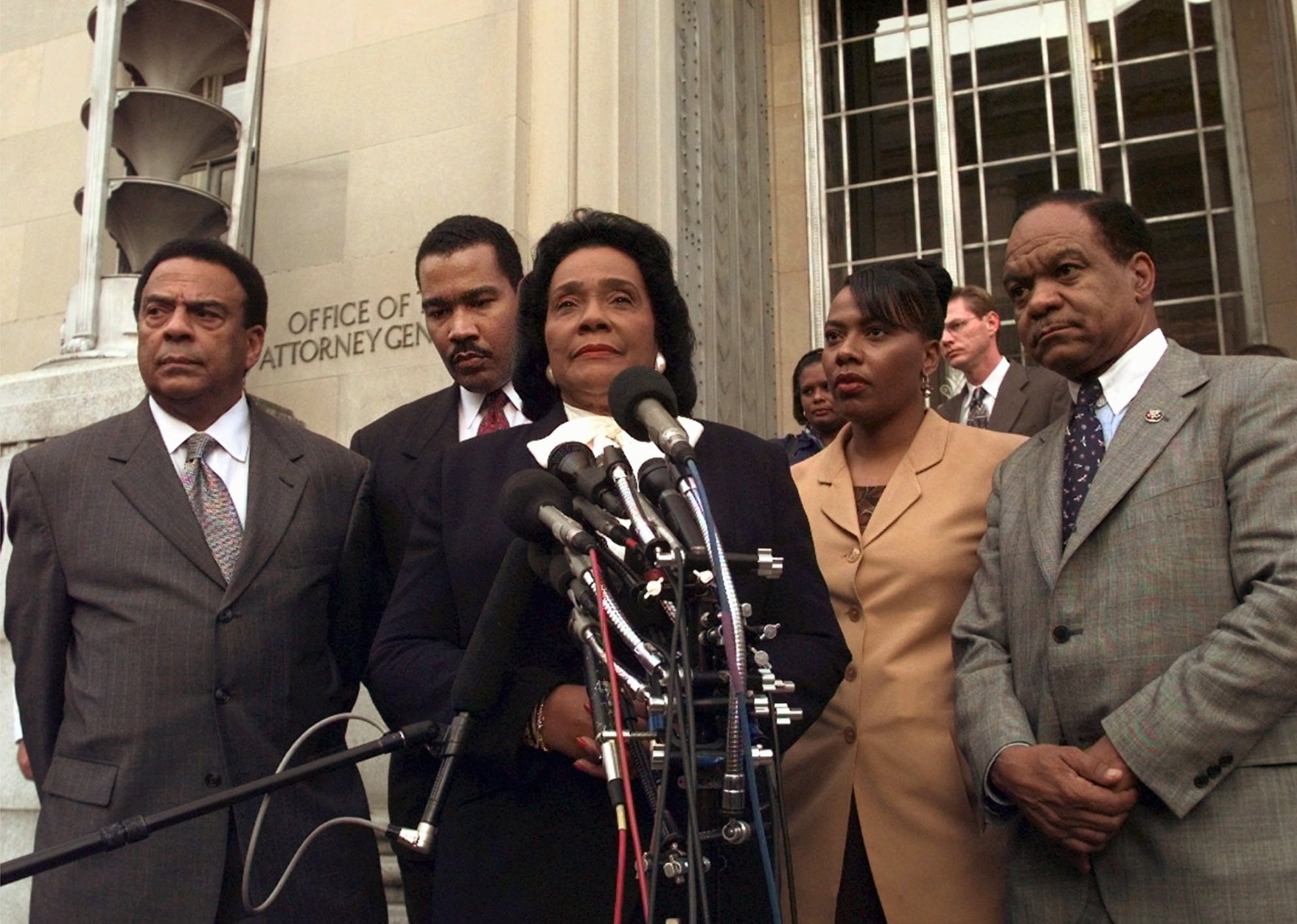 Coretta Scott King, center, widow of slain civil rights leader Dr. Martin Luther King Jr., talks to reporters outside of the Justice Department, Wednesday, April 8, 1998, in Washington after meeting with Attorney General Janet Reno.  Mrs. King is flanked by former U. N. Ambassador Andrew Young, far left; her son Dexter; her daughter, The Rev. Bernice King; and Washington, D.C. Congressional Delegate Walter Fauntroy, right. Mrs. King told reporters she had presented new evidence about the 1968 assassination of her husband.    (AP Photo/Wilfredo Lee)