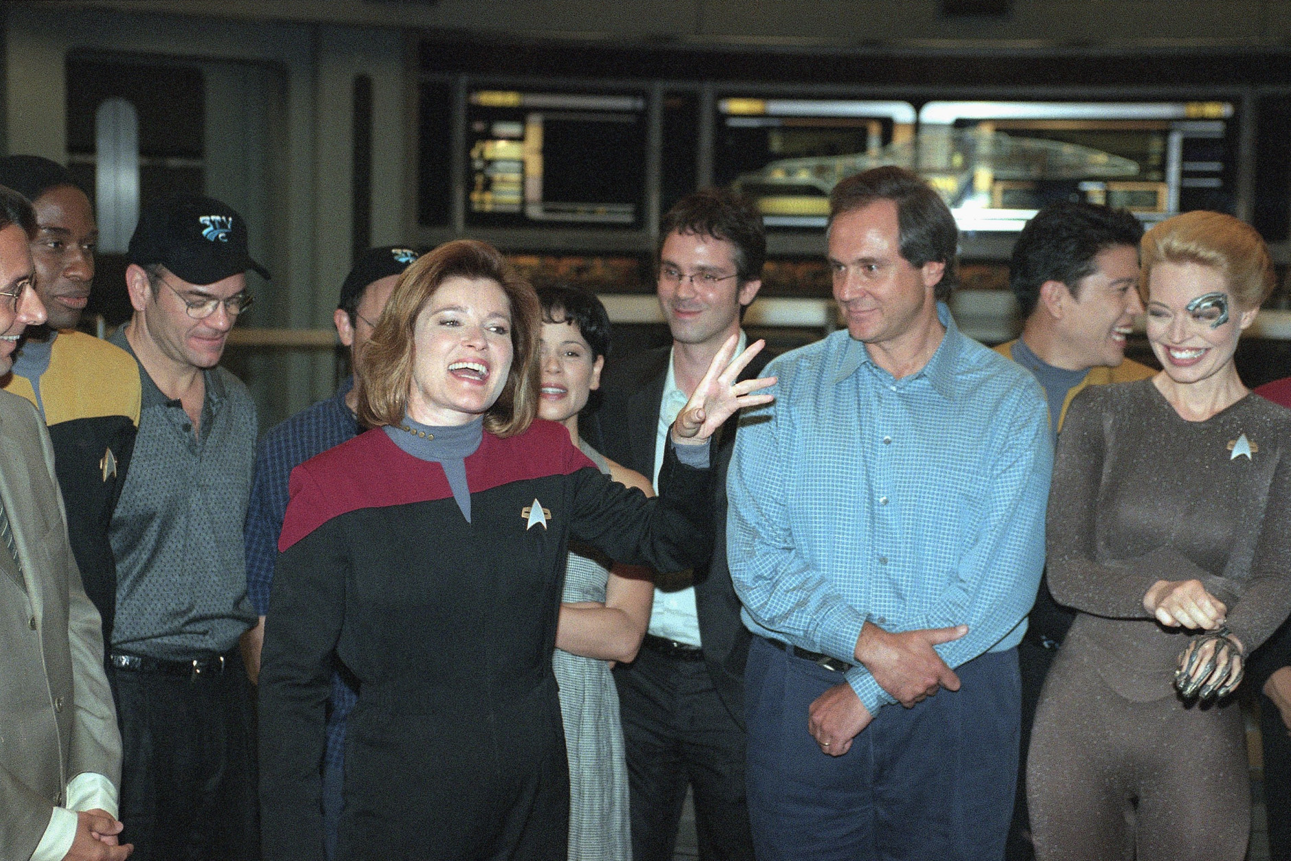 Kate Mulgrew, who stars as Capt. Kathryn Janeway on ?Star Trek: Voyager,? acknowledges cast, crew and writers for the success of the Paramount Network Television show at a party celebrating the filming of the series 100th episode on the Paramount lot in Los Angeles, Wednesday, August 12, 1998. From left are cast members Robert Picardo, Ethan Phillips (partly hidden) and Roxann Dawson, executive producer Brannon Braga, creator and executive producer Rick Berman, and cast members Garrett Wang and Jeri Ryan. The series begins its fifth season on UPN in the fall. (AP Photo/Reed Saxon)