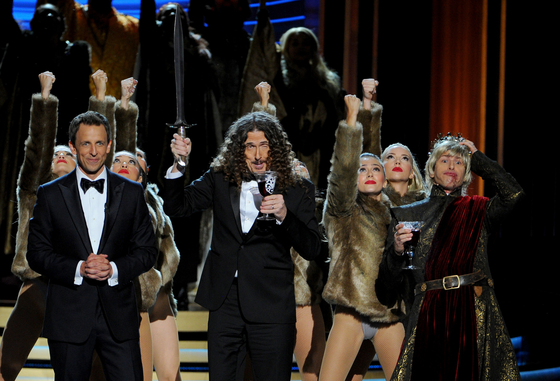Seth Meyers, and from left, Weird Al Yankovic and Andy Samberg perform on stage at the 66th Primetime Emmy Awards at the Nokia Theatre L.A. Live on Monday, Aug. 25, 2014, in Los Angeles. (Photo by Vince Bucci/Invision for the Television Academy/AP Images)