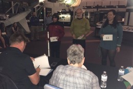 The judges evaluate the contestants of the Star Trek costume contest at the National Air and Space Museum. (WTOP/Michelle Basch)