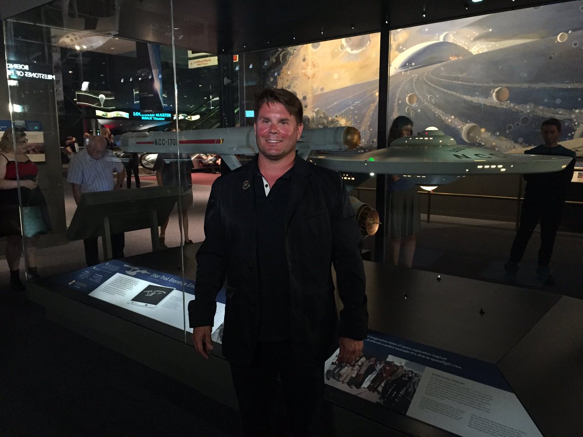 Rod Roddenberry in front of the StarTrek Starship Enterprise studio model at the National Air and Space Museum. (WTOP/Michelle Basch)