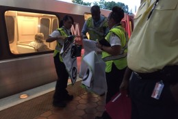 Metro staff had to get rid of temporary signage that pointed commuters to the wrong trains at the West Falls Church Metrorail station on Thursday, Sept. 15, 2016. A Metro spokeswoman says it's not clear why the signs were posted erroneously. (WTOP/Neal Augenstein)
