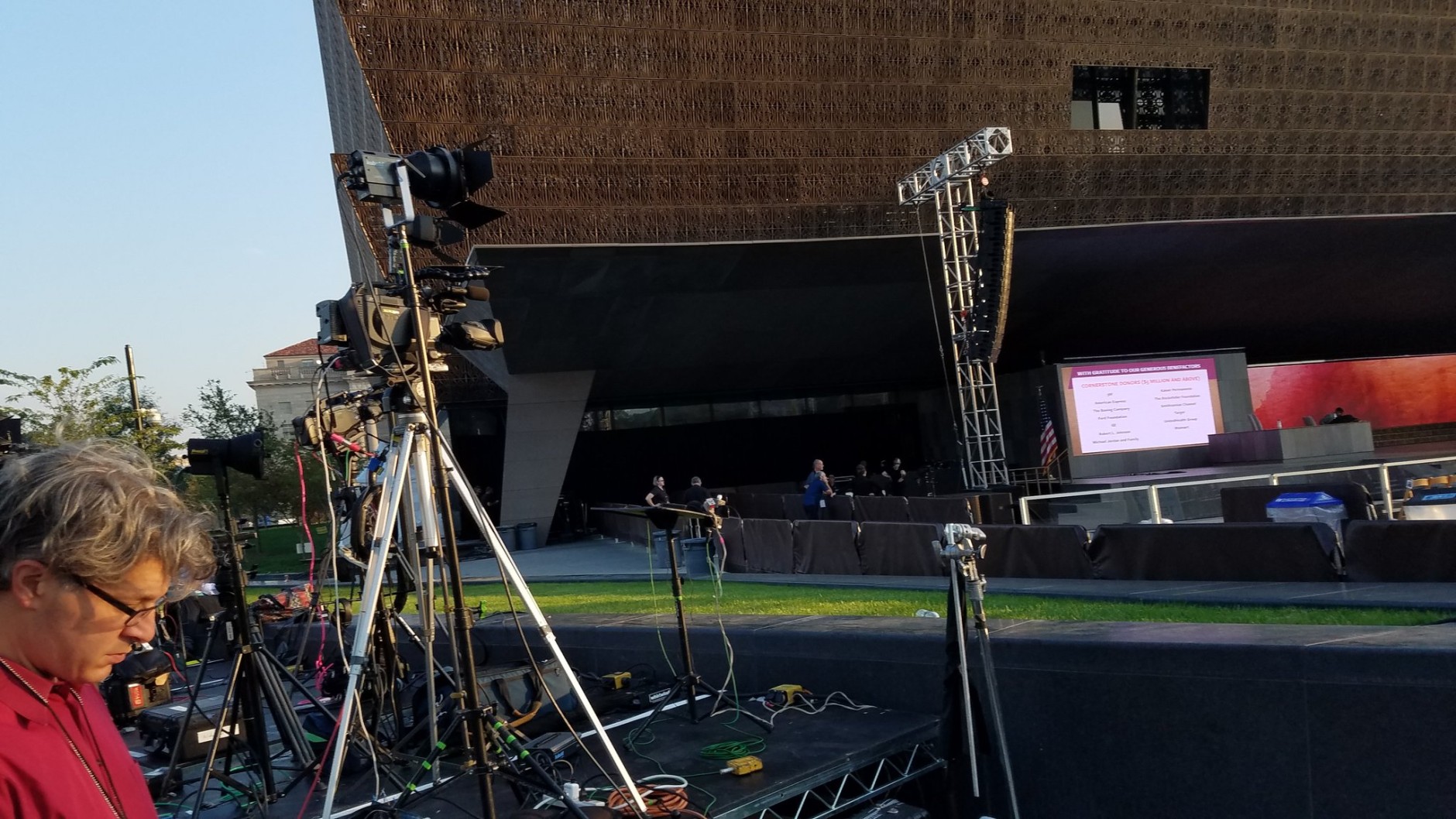 The media sets up for the opening event of the Smithsonian's National Museum of African American History and Culture. (WTOP/Allison Keyes)