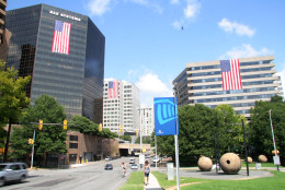 This photo provided by the Rosslyn BID shows several flag-draped office buildings in Rosslyn on Friday, Sept. 9, 2016. Twenty-five buildings this year will display flags, a now annual remembrance of the Sept. 11 terror attacks. (Courtesy Rosslyn Business Improvement District)