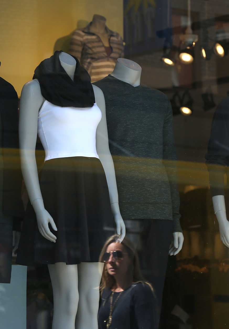 SAN FRANCISCO, CA - SEPTEMBER 12:  A pedestrian looks at a window display at a Lululemon retail store on September 12, 2014 in San Francisco, California.  Athletic clothing retailer Lululemon Athletica Inc. reported better than expected second quarter profits with net income of $48.7 million, or 33 cents per share compared to $56.5 million, or 39 cents per share one year ago.  (Photo by Justin Sullivan/Getty Images)