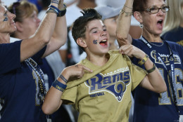 LOS ANGELES, CALIFORNIA - AUGUST 13:  A young Rams fan cheers during the game between the Dallas Cowboys and the Los Angeles Rams at the Los Angeles Coliseum during preseason on August 13, 2016 in Los Angeles, California.  The Rams won 28-24.  (Photo by Stephen Dunn/Getty Images)