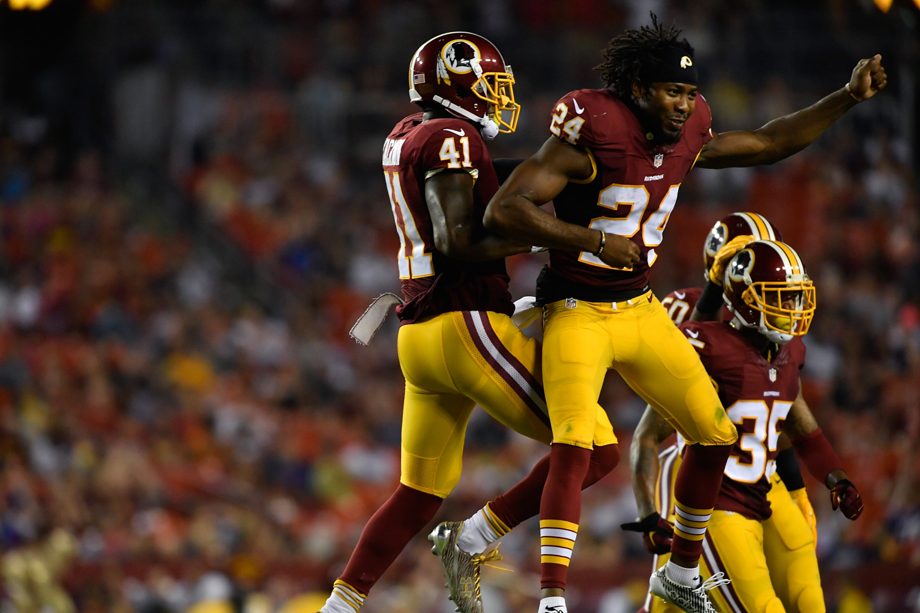 LANDOVER, MD - AUGUST 26:  Cornerback Will Blackmon #41 of the Washington Redskins and defensive back Josh Norman #24 of the Washington Redskins celebrate a third quarter fumble recovery during the game between the Washington Redskins and the Buffalo Bills at FedExField on August 26, 2016 in Landover, Maryland. The Redskins defeated the Bills 21-16.  (Photo by Larry French/Getty Images)