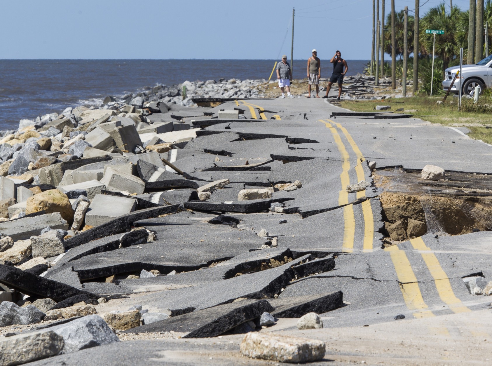 ALLIGATOR POINT, FL - SEPTEMBER 02:  Residents look at Alligator Point road that collapsed during the storm surge from Hurricane Hermine at Alligator Point, Florida on September 2, 2016. Hermine made landfall as a Category 1 hurricane but has weakened back to a tropical storm. (Photo by Mark Wallheiser/Getty Images)