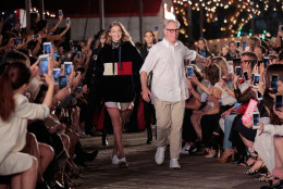NEW YORK, NY - SEPTEMBER 09:  Model Gigi Hadid (L) and designer Tommy Hilfiger walk the runway at #TOMMYNOW Women's Fashion Show during New York Fashion Week at Pier 16 on September 9, 2016 in New York City.  (Photo by Randy Brooke/Getty Images for Tommy Hilfiger)