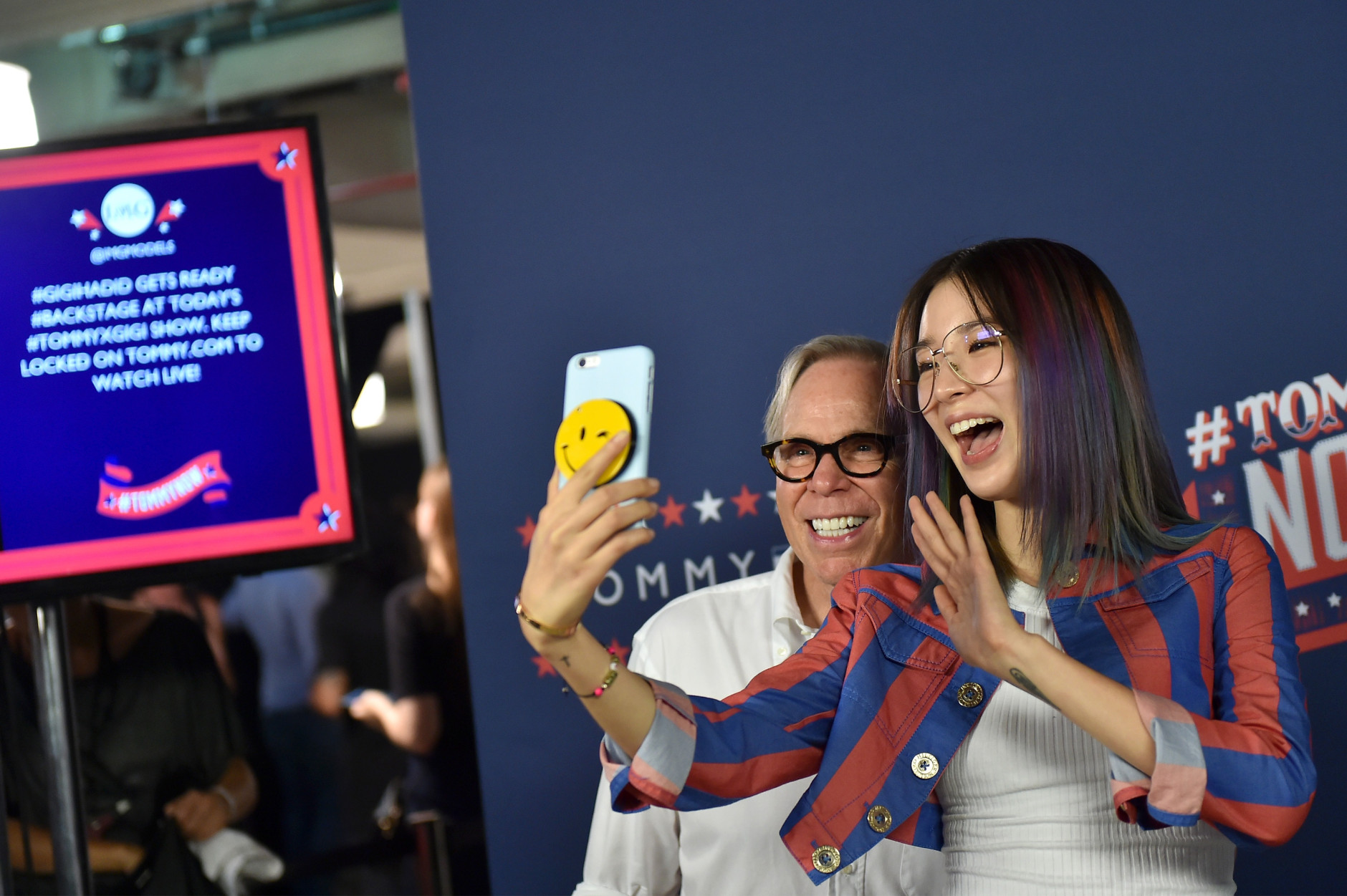 NEW YORK, NY - SEPTEMBER 09:  Designer Tommy Hilfiger and Irene Kim pose backstage at the #TOMMYNOW Women's Fashion Show during New York Fashion Week at Pier 16 on September 9, 2016 in New York City.  (Photo by Mike Coppola/Getty Images for Tommy Hilfiger)