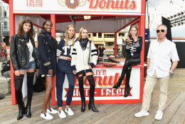 NEW YORK, NY - SEPTEMBER 09:  Model Gigi Hadid (2nd from right) and fashion designer Tommy Hilfiger (R) pose with models during the #TOMMYNOW Women's Fashion Show during New York Fashion Week at Pier 16 on September 9, 2016 in New York City.  (Photo by Mike Coppola/Getty Images for Tommy Hilfiger)