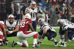 GLENDALE, AZ - SEPTEMBER 11: Quarterback Jimmy Garoppolo #10 of the New England Patriots calls a play on the line of scrimmage in the first quarter of the NFL game against the Arizona Cardinals at University of Phoenix Stadium on September 11, 2016 in Glendale, Arizona.  (Photo by Norm Hall/Getty Images)