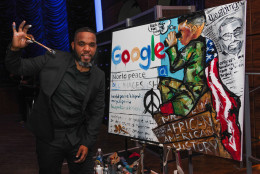 WASHINGTON, DC - SEPTEMBER 16:  Demont Pinder poses with his painting at Google 4 NMAAHC celebrating the opening of the National Museum of African American History and Culture on September 16, 2016 in Washington, DC.  (Photo by Teresa Kroeger/Getty Images for Google)