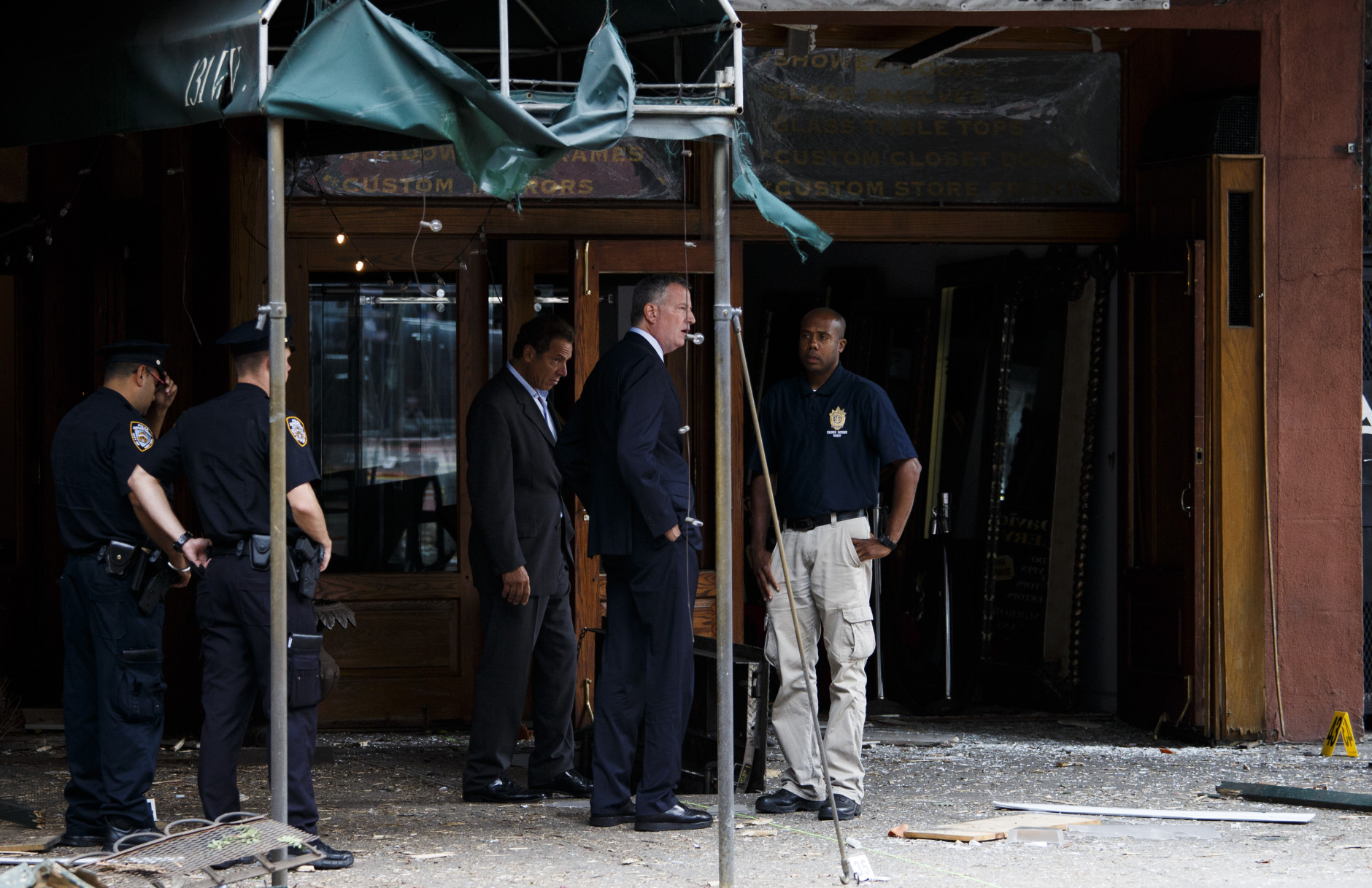 NEW YORK, NY - SEPTEMBER 18: New York Mayor Bill de Blasio (2nd R) and New York Governor Andrew Cuomo (3rd R) tour the site of an explosion that occurred on Saturday night on September 18, 2016 in the Chelsea neighborhood of New York City. An explosion in a construction dumpster that injured 29 people is being labeled an "intentional act". A second device, a pressure cooker, was found four blocks away that an early investigation found was likely also a bomb. (Photo by Justin Lane-Pool/Getty Images)
