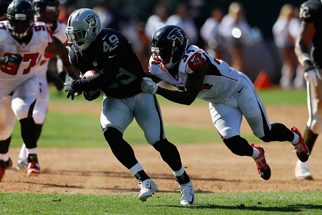 OAKLAND, CA - SEPTEMBER 18: Jamize Olawale #49 of the Oakland Raiders runs with the ball against the Atlanta Falcons during their NFL game at Oakland-Alameda County Coliseum on September 18, 2016 in Oakland, California. (Photo by Jason O. Watson/Getty Images)