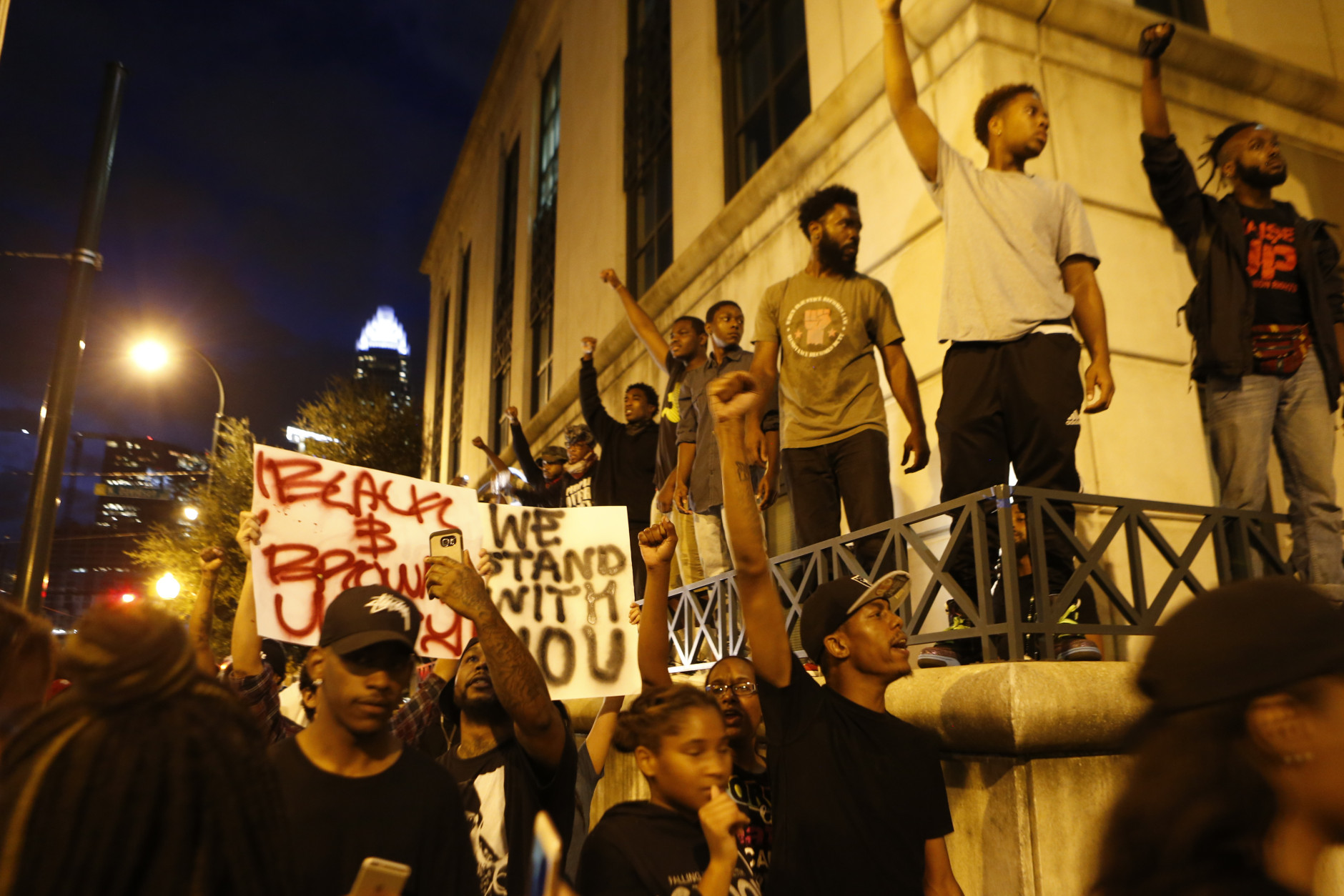 CHARLOTTE, NC - SEPTEMBER 21:  Protestors surround the Charlotte Police department as residents and activists protest the death of Keith Scott September 21, 2016 in Charlotte, North Carolina. Scott, who was black, was shot and killed at an apartment complex near UNC Charlotte by police officers, who say they warned Scott to drop a gun he was allegedly holding.  (Photo by Brian Blanco/Getty Images)