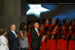 President Barack Obama, accompanied by first lady Michelle Obama, former president George Bush and former first lady Laura Bush, participate in the dedication of the National Museum of African American History and Culture Sept. 24, 2016 in Washington, D.C, before the museum opens to the public later that day. The museum is a Smithsonian Institution museum located on the National Mall featuring African American history and culture in the US. (Photo by Astrid Riecken/Getty Images)