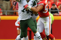 KANSAS CITY, MO - SEPTEMBER 25: Quarterback Ryan Fitzpatrick #14 of the New York Jets tries to throw a pass during the tackle attempt of outside linebacker Frank Zombo #51 of the Kansas City Chiefs at Arrowhead Stadium during the second quarter of the game on September 25, 2016 in Kansas City, Missouri. (Photo by Peter Aiken/Getty Images)