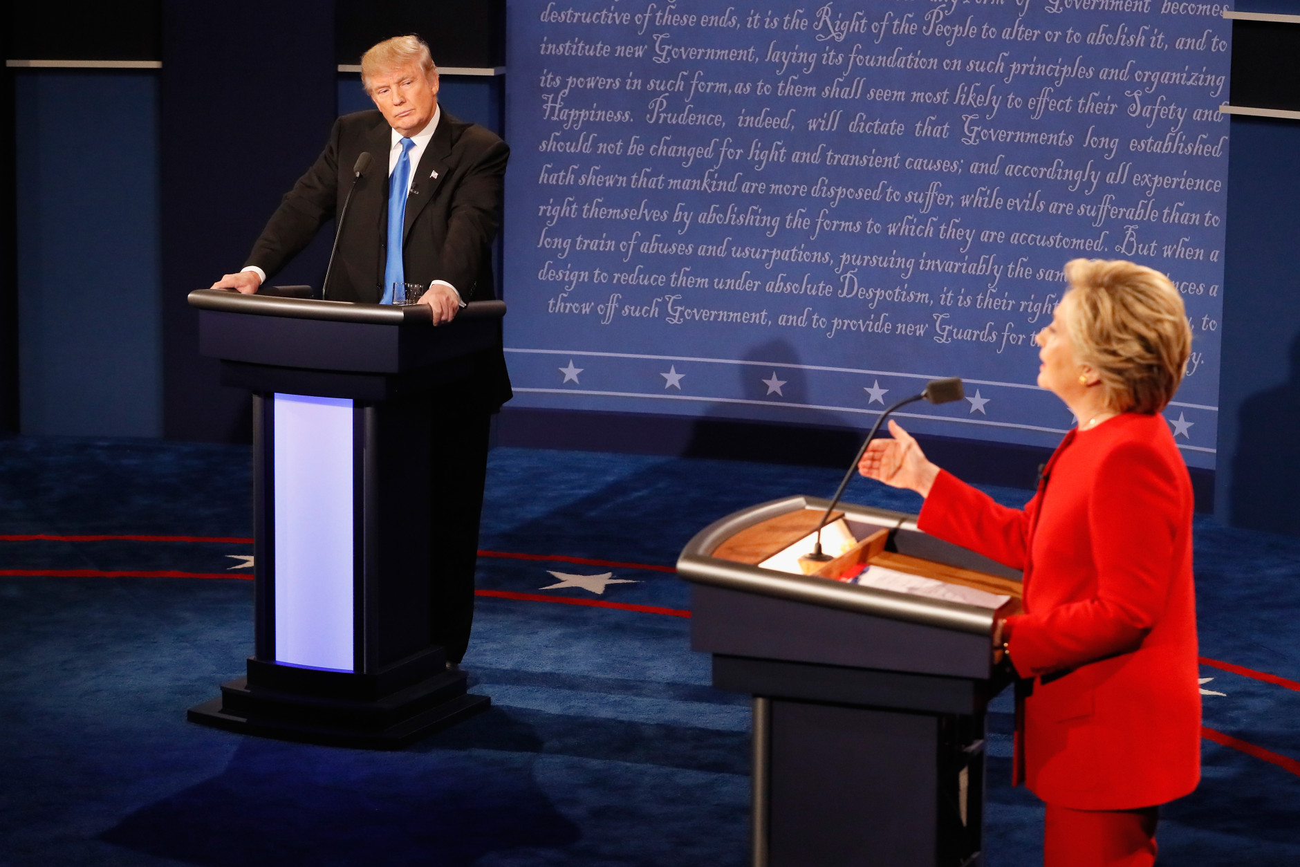 HEMPSTEAD, NY - SEPTEMBER 26:  Democratic presidential nominee Hillary Clinton (R) speaks as Republican presidential nominee Donald Trump (L) listens during the Presidential Debate at Hofstra University on September 26, 2016 in Hempstead, New York.  The first of four debates for the 2016 Election, three Presidential and one Vice Presidential, is moderated by NBC's Lester Holt.  (Photo by Pool/Getty Images)